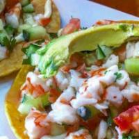 Especial Tostada De Ceviche De Camaron · Freshest shrimp marinated in lime juice mixed with diced tomatoes, cucumber, onion and cilan...
