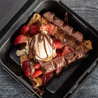 Kinder Crepe  · Inside: Nutella
On Top: Strawberries, Vanilla iced cream, Extra Nutella and Chocolate Kinder...
