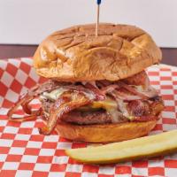 Flamin' Moo · On a kaiser bun with Pepper Jack cheese, bacon, grilled onions, ranch dressing and  sliced j...