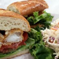 Fried Fish Sandwich · Beer battered cod fish, on a grilled steak roll, lettuce, tomato, and tartar sauce.