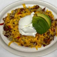 Special Spuds · Russell’s Hash Browns mixed with chopped bacon, onions, bell peppers, topped with melted Che...