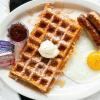 Belgian Waffle Breakfast · Belgian waffle with one egg & choice of bacon or sausage.
