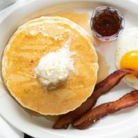 Ranch Breakfast · Three Pancakes, one egg and choice of bacon or sausage.