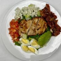 Cobb Salad · Sliced grilled chicken breast, bacon, avocado, tomato, egg & crumbled Blue cheese.  Served w...