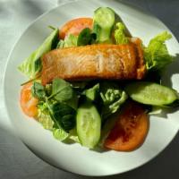 Filet Of Salmon Salad · Pan seared filet of salmon  on a bed of mixed lettuce and tomato.  Served with your choice o...