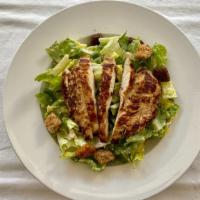 Chicken Caesar Salad · Romaine lettuce, croutons, Parmesan cheese tossed with Caesar dressing and topped with a gri...