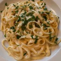Fettuccine Alfredo · Fettuccine tossed with creamy Alfredo sauce.  Served with a salad.