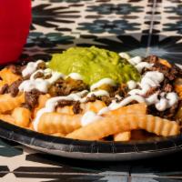 Ranchero Fries · Includes Meat, Cheese, Sour Cream, & Guacamole