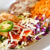 Taquitos Rancheros · Three (3) corn  taquitos rolled with choice of beef or chicken, deep fried and served with r...
