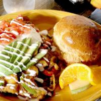 Mexican Skillet · Juicy steak, mushrooms, red pepper, onions, jack cheese topped with avocado, sour cream, tom...