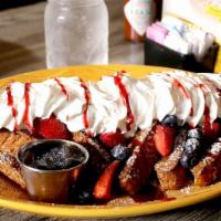 Berry Berry French Toast · Fresh blackberries, strawberries and blueberries topped with whipped cream, raspberry sauce,...