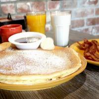 Pancake Combo · Short stack sprinkled with powdered sugar, served with two any style eggs, bacon, ham or sau...
