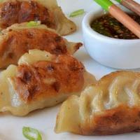 Pot Stickers · China One favorite: Six pieces. Pan fried chicken dumpling filled with green onions.