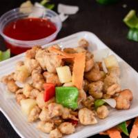Sweet & Sour Pork · Crispy breaded pork with onion, bell pepper, carrots and diced pineapple glazed with sweet a...