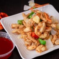 Sweet & Sour Chicken · Crispy breaded white meat chicken with bell pepper, onion, carrots and diced pineapple glaze...