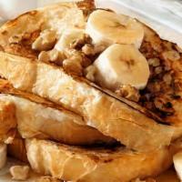 French Toast Combo · Four slices of thick, egg-washed cinnamon bread served with maple syrup and powdered sugar, ...