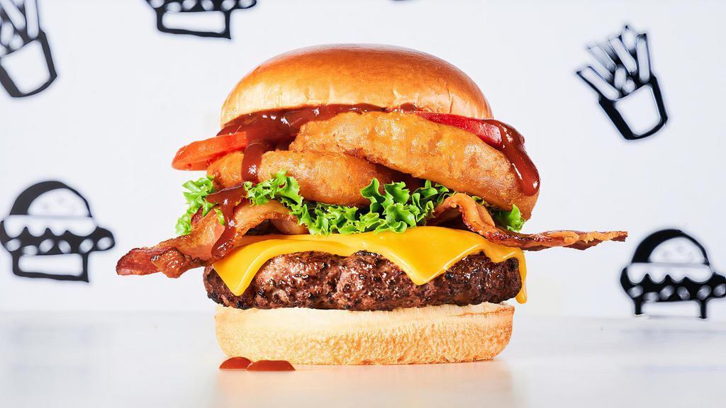 Butch’S Wild Bbq Burger · Burger, BBQ sauce, cheddar cheese, beef bacon, onion rings, lettuce & tomato