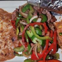 Fajitas · Chicken, steak, or shrimp seasoned to perfection and mixed with onions, red & green bell pep...