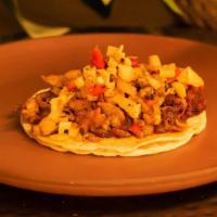 Al Pastor Con Pina Taco · Seasoned pork served with pineapple chunks.