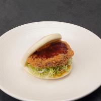Impossible Bun (V) · Panko fried impossible plant meat,
shredded cabbage and katsu sauce.