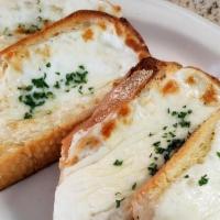 Garlic Bread · House made bread toasted with olive oil and fresh garlic.