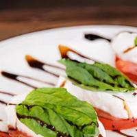 Caprese · Fresh mozzarella, fresh sliced tomato & Fresh basil. Served with olive oil and balsamic redu...