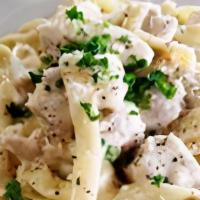 Fettuccine Alfredo W/Chicken · Chopped chicken breast tossed with fettuccine and 