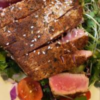 Blackened Ahi Tuna Salad · Signature local mixed greens, Persian cucumber, red onions, daikon sprouts, cherry tomatoes,...
