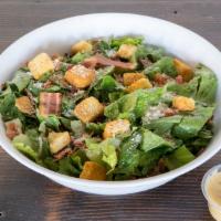 Caesar Salad
 · Romaine lettuce shaved Parmesan, croutons, bacon, and Caesar dressing.