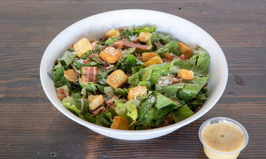 Caesar Salad
 · Romaine lettuce shaved Parmesan, croutons, bacon, and Caesar dressing.