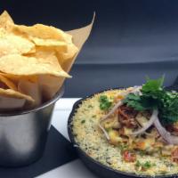 Artichoke Dip · Tomato tapenade, herbs, tortilla chips