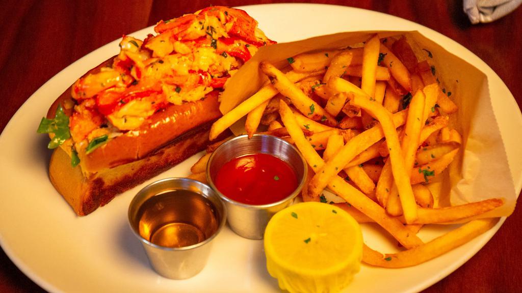 Lobster Roll · Butter-poached atlantic lobster, brown-butter aioli, arugula, melted butter, toasted brioche bun, garlic fries