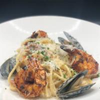 Seafood Pasta · Blackened shrimp, scallops, mussels, bucatini pasta, garlic, cream, tomatoes, asparagus, par...