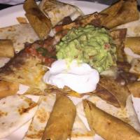 Papi'S Sampler · House specialty. Beef or chicken taquitos, nachos, quesadillas, served with guacamole, sour ...