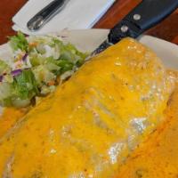 Surf Turf Burrito · House specialty. Steak or chicken, filled with shrimp, rice, beans and cheese. Topped with a...