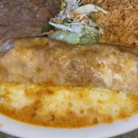 Enchiladas Suizas · Two seafood enchiladas wrapped in flour tortillas topped with our special sauce and sour cre...