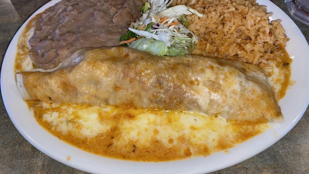 Enchiladas Suizas · Two seafood enchiladas wrapped in flour tortillas topped with our special sauce and sour crema. Rice and beans included.