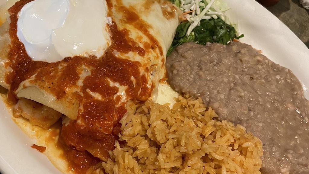 Enchiladas De Camaron · Three shrimp enchiladas topped with our ranchera salsa, jack cheese and sour cream. Rice and beans included.