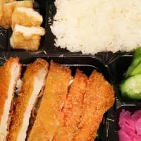 Pork Or Chicken Katsu Bento Box · Deep fried pork or chicken cutlet with rice, tofu, pickled cucumber, and radish.
