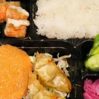 Croquette (W/ Gyoza) Bento Box · 1 Potato Croquette with 2 deep fried gyozas (pork) with rice, tofu, pickled cucumber, and ra...