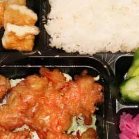 Karaage Chicken Bento Box · Karaage Chicken with rice, tofu, pickled cucumber, and radish.
