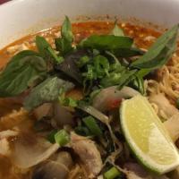 Tom Yum · White mushroom, Thai herbs, onion in hot and sour soup.