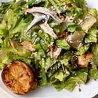 Caesar Salad · Romaine hearts, boquerones, Parmigiano, grilled lemon, croutons, caesar dressing.