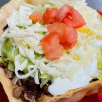 1 Taco Salad · meat, rice, whole beans, salsa, guacamole, sour cream, cheese, and lettuce