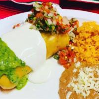 Chumichanga  Burrito · meat, cheese, topped with guacamole, sour cream, salsa with rice and beans on the side.