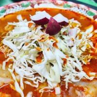 Medium Pozole · our delicious homemade red pozole made with pork meat and hominy.
includes homemade tostadas...