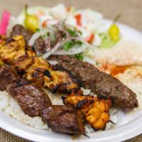 Combination Plate · Your choice of any three meats. Served with rice, hummus, salad and pita bread.
