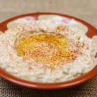 Baba Ghanouj (8 Ounces) · Paste of grilled eggplant mixed with sesame sauce, garlic and fresh lemon juice.