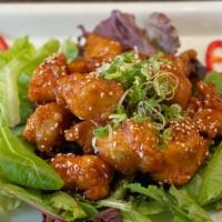 Sesame Chicken · Deep fried chicken breast in ginger sesame sauce.