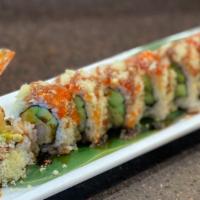 Crunchy Roll · Shrimp tempura, avocado and cucumber roll topped with smelt roe, tempura flakes and eel sauce.